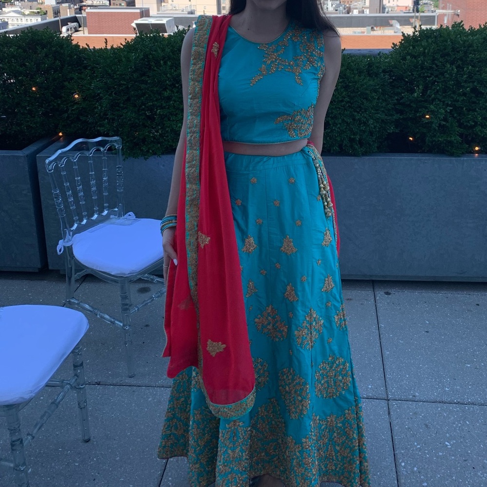 Teal Embroidered saree with Gold Accents